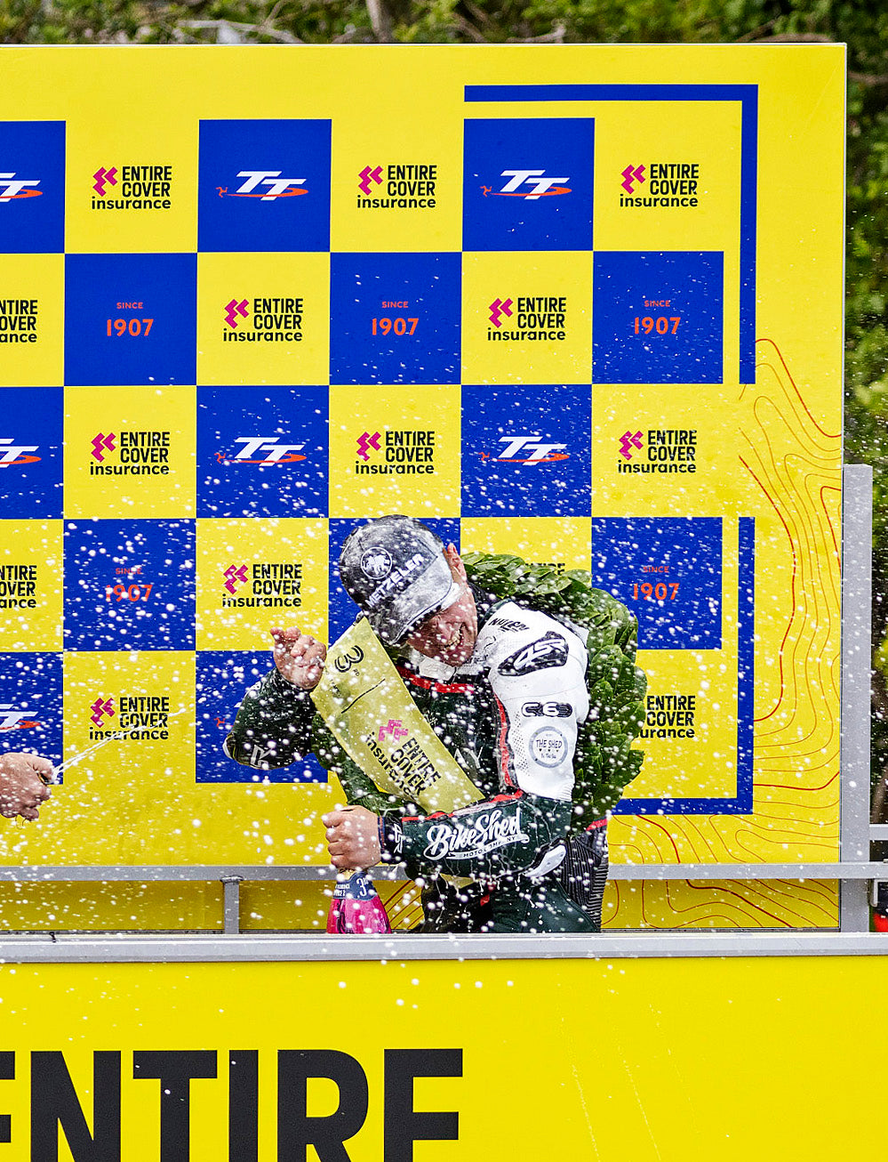 Isle of Man TT Races 2025 Entire Cover insurance Supertwin Race 2 Podium Backdrop